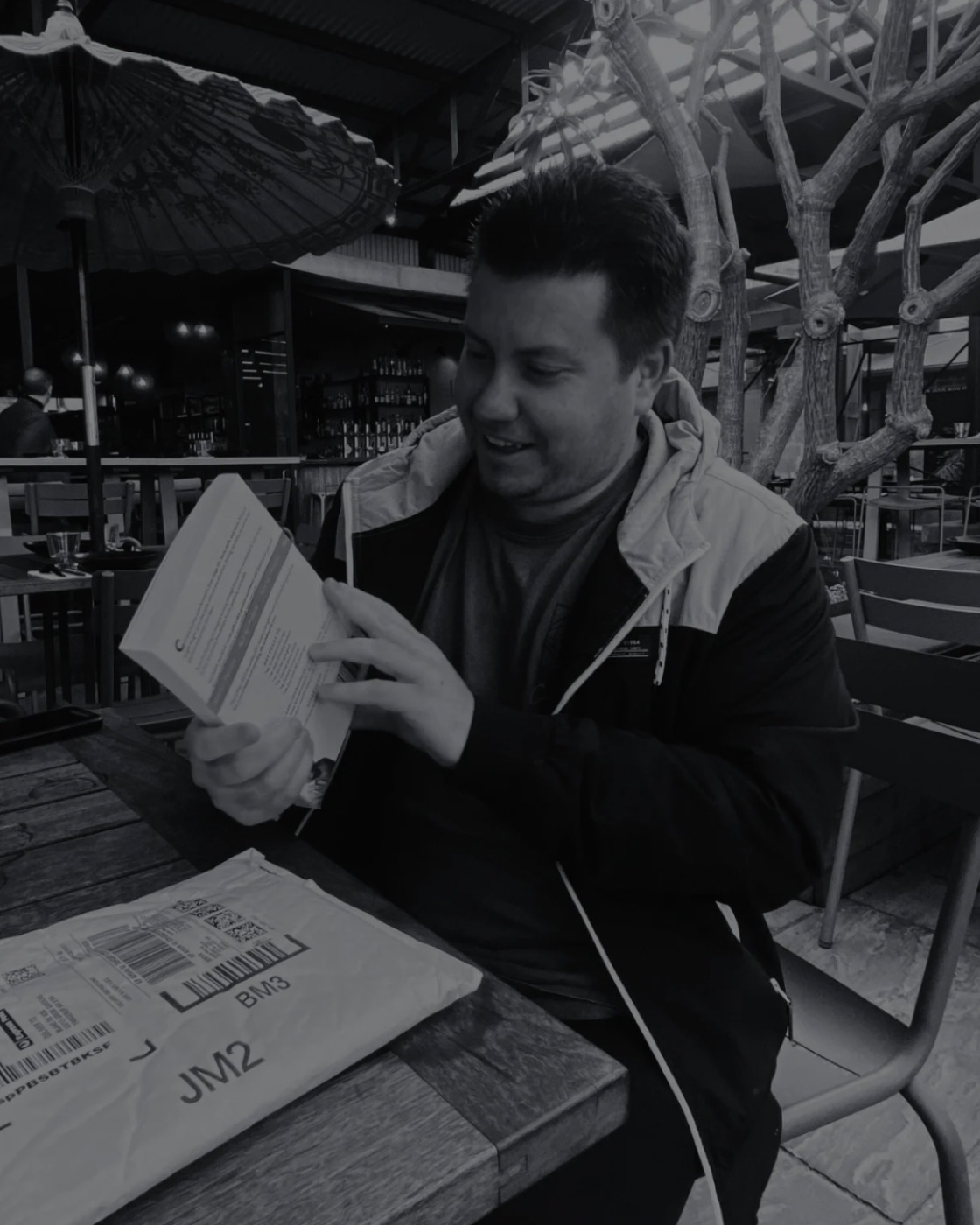 Blake de Vos opening a freshly delivered book